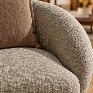 Fauteuil « Cocon » en tissu bouclé beige – Forme arrondie enveloppante