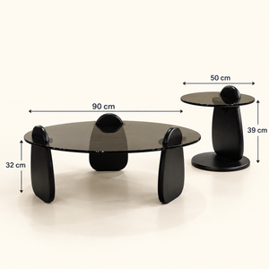 Ensemble de tables basses en galets – Piètements noirs sculptés et plateaux en verre fumé