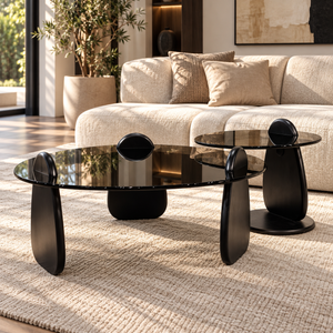 Ensemble de tables basses en galets – Piètements noirs sculptés et plateaux en verre fumé