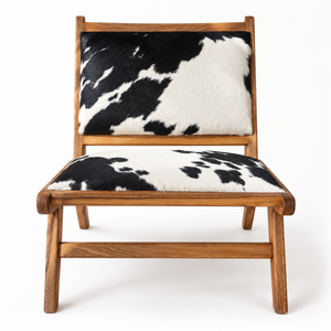 Fauteuil lounge « Pampa » en teck et peau de vache noir et blanc – Design bas